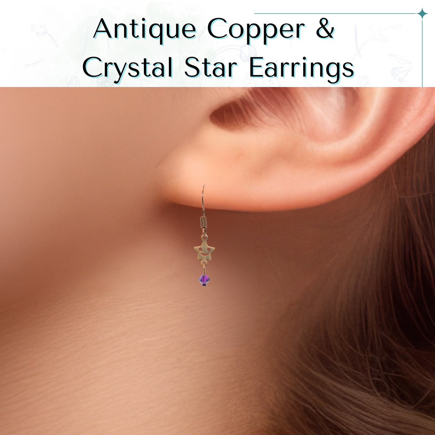 Antique copper and crystal star earring worn by a person with a neutral background