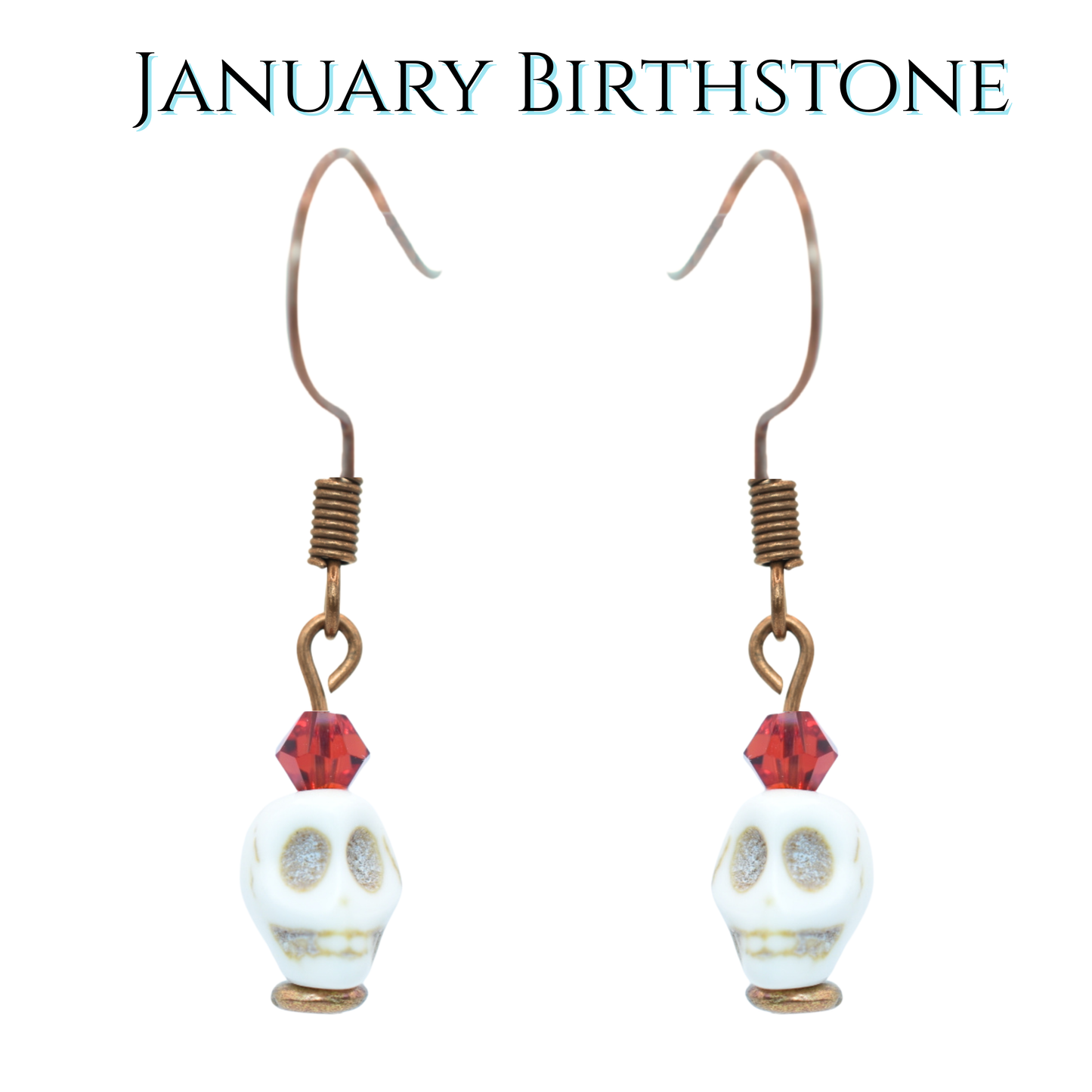 Skull-shaped earrings with red crystal beads on a white background, labeled 'January Birthstone'.