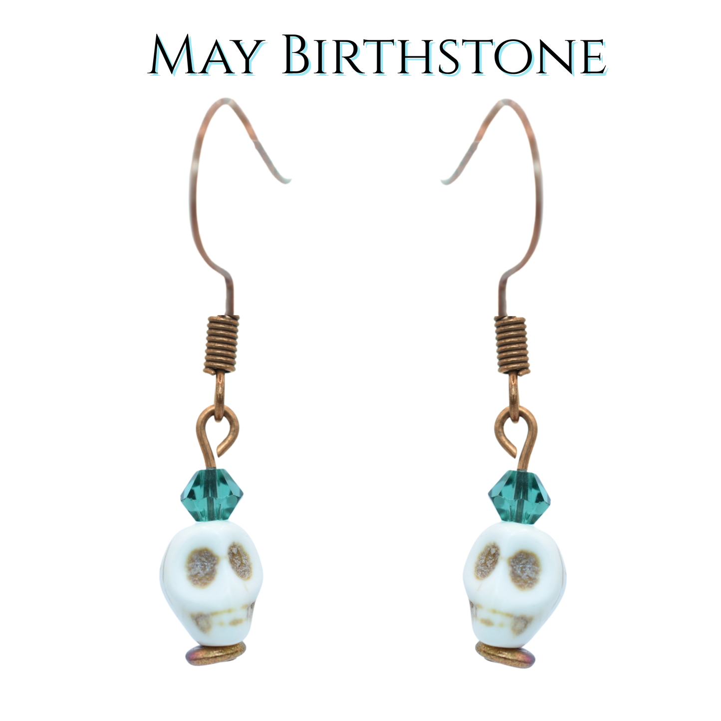 Earrings with white skull beads and dark green crystal beads on a white background, labeled 'May Birthstone'.