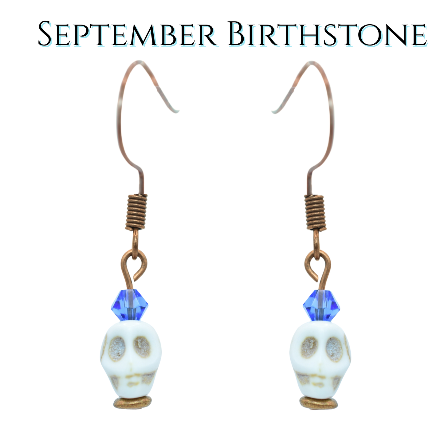 Skull-shaped earrings with blue crystal beads on a white background, labeled 'September Birthstone'.