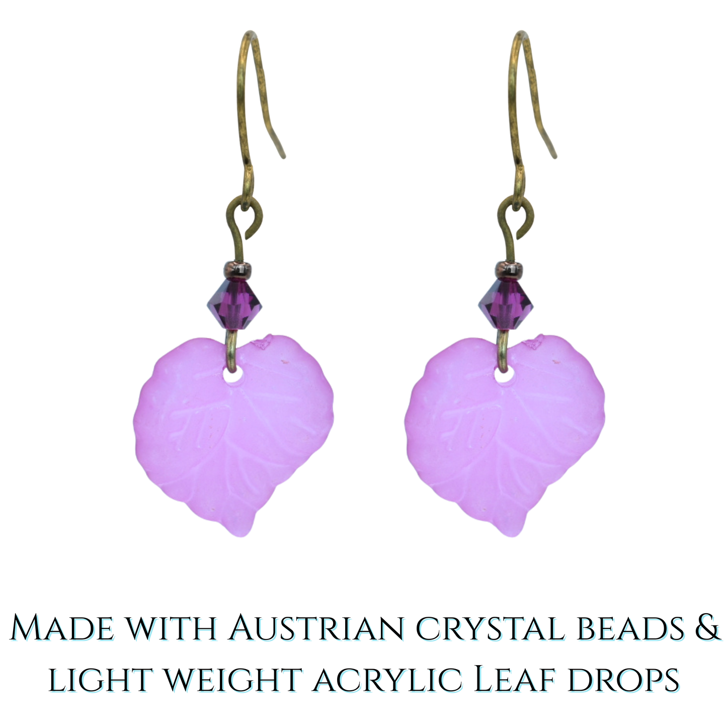 Pink leaf-shaped earrings with gold hooks on a white background