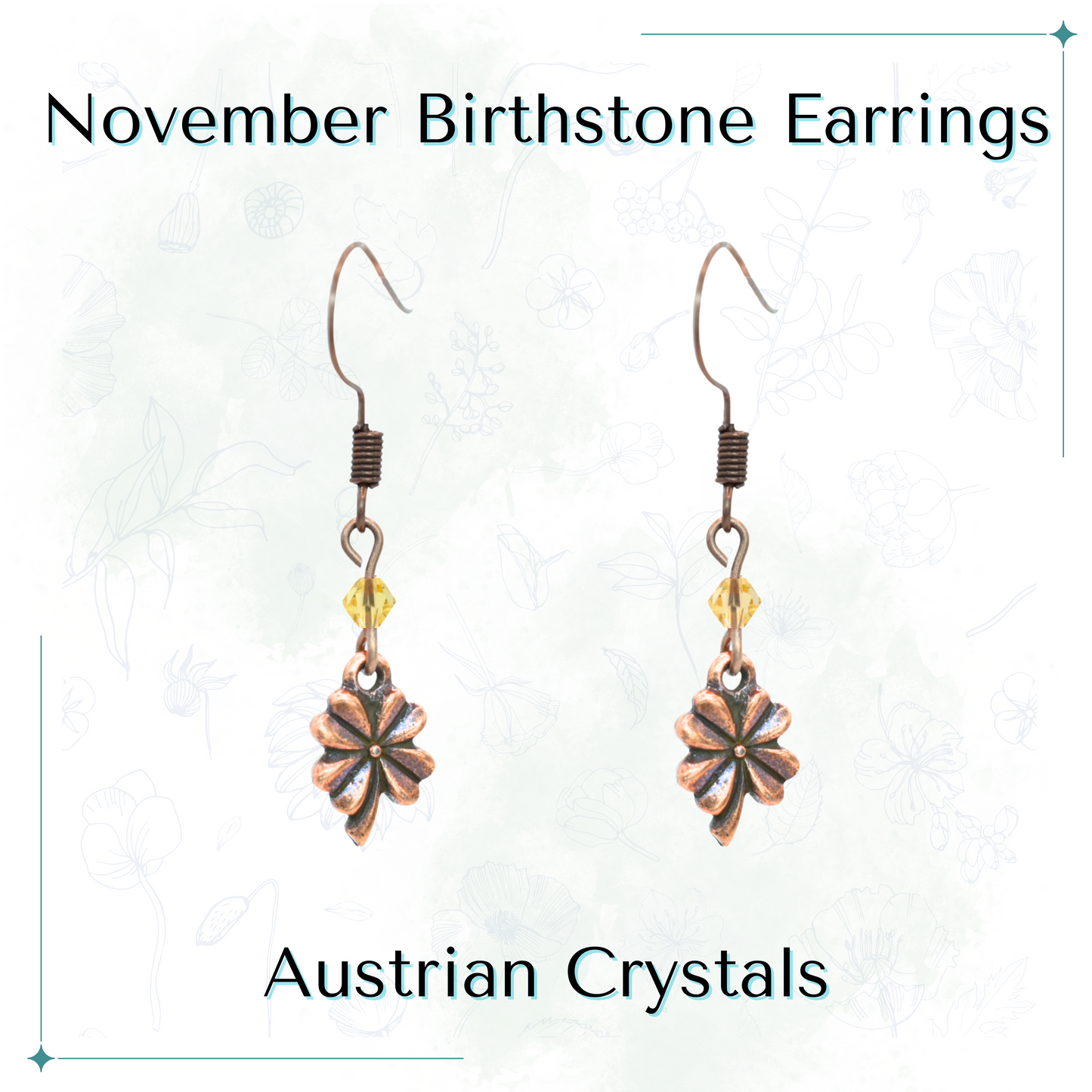 Antique copper earrings with topaz Austrian crystals and a Four Leaf Clover charm on a white background, labeled 'November Birthstone Earrings'