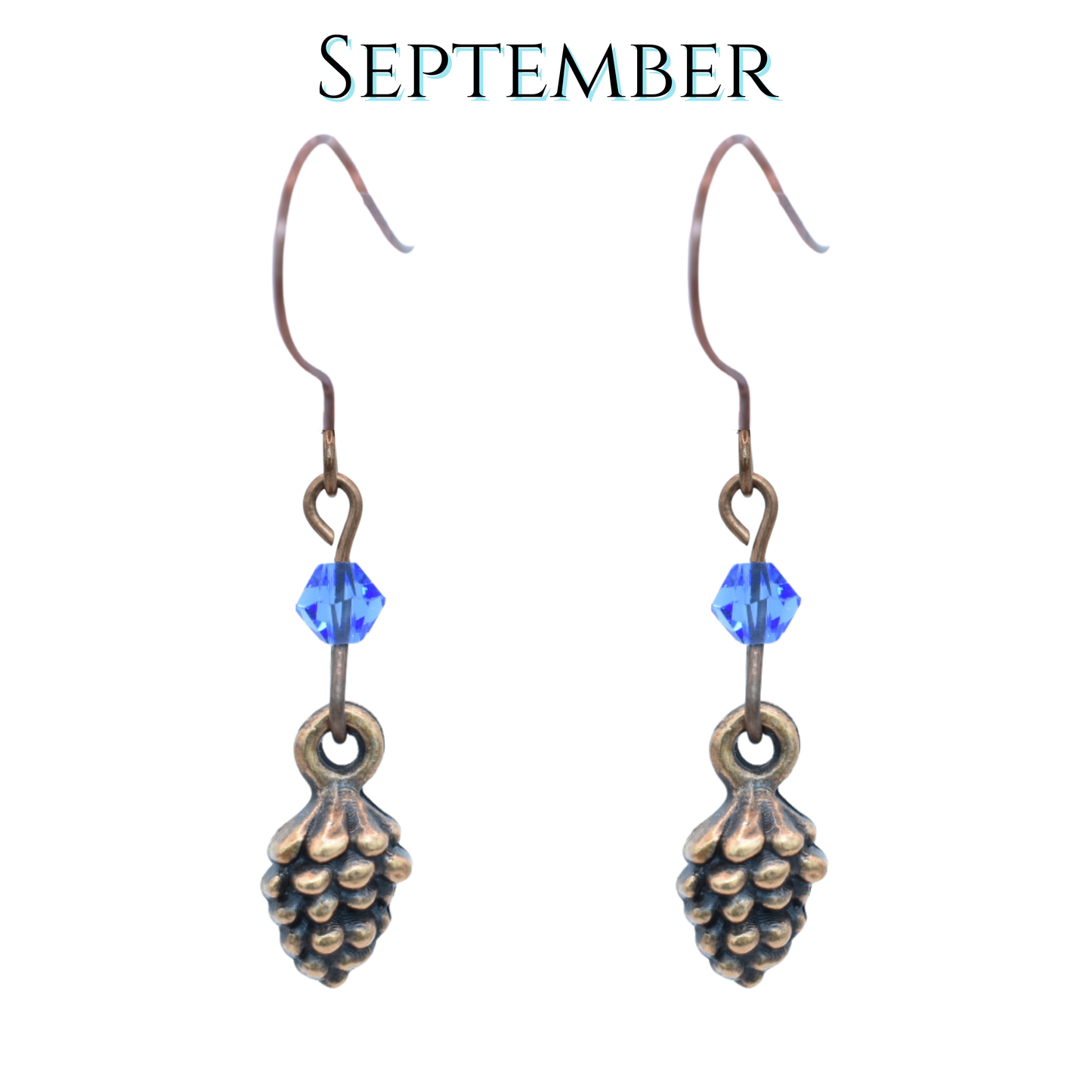 Pine cone-shaped earrings with sapphire blue crystal beads on a white background, labeled 'September'.
