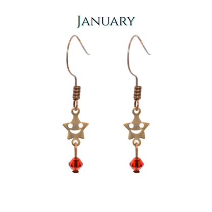 Star-shaped earrings with red beads on a white background, labeled 'January'.