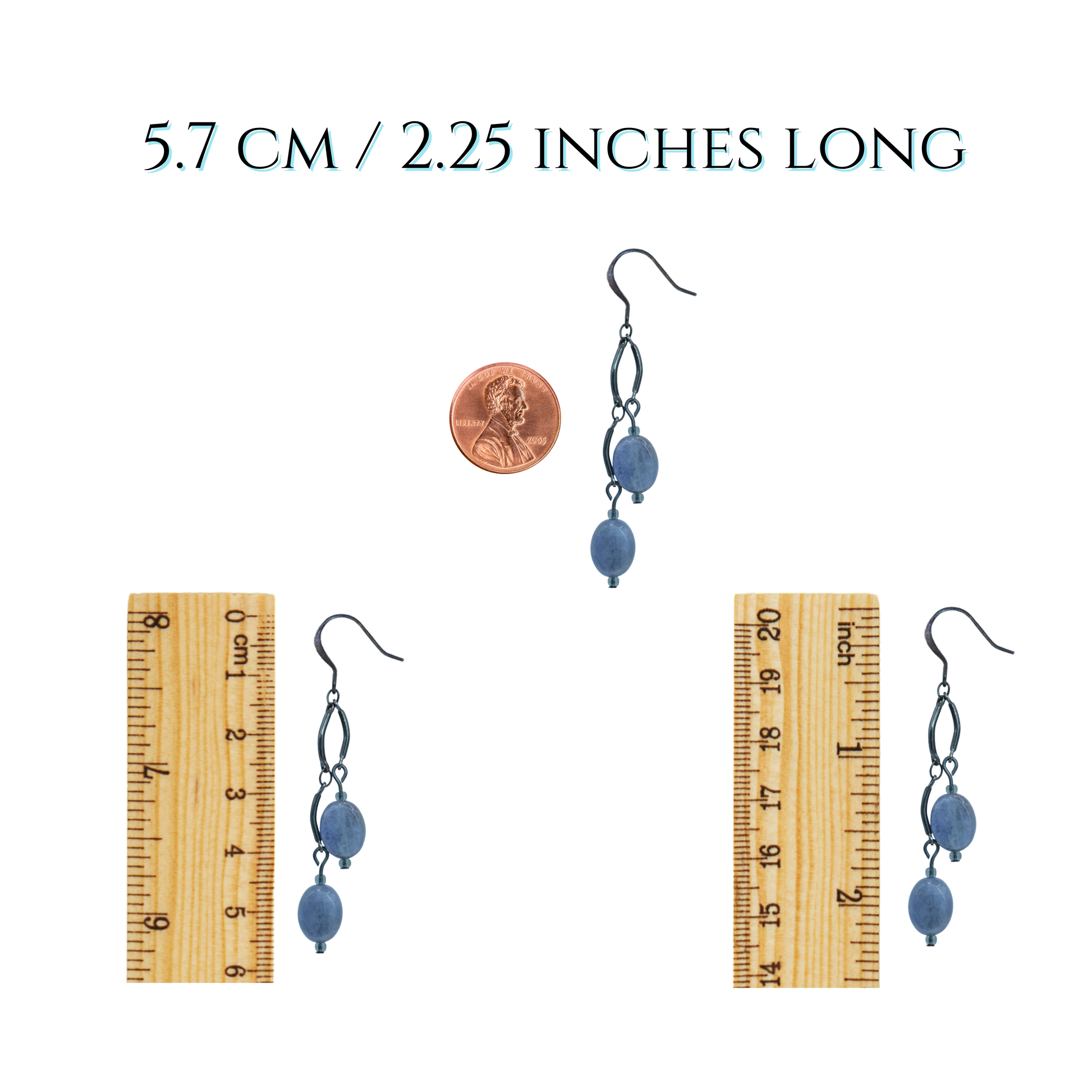 Pair of gray beaded earrings with a ruler for scale on a white background