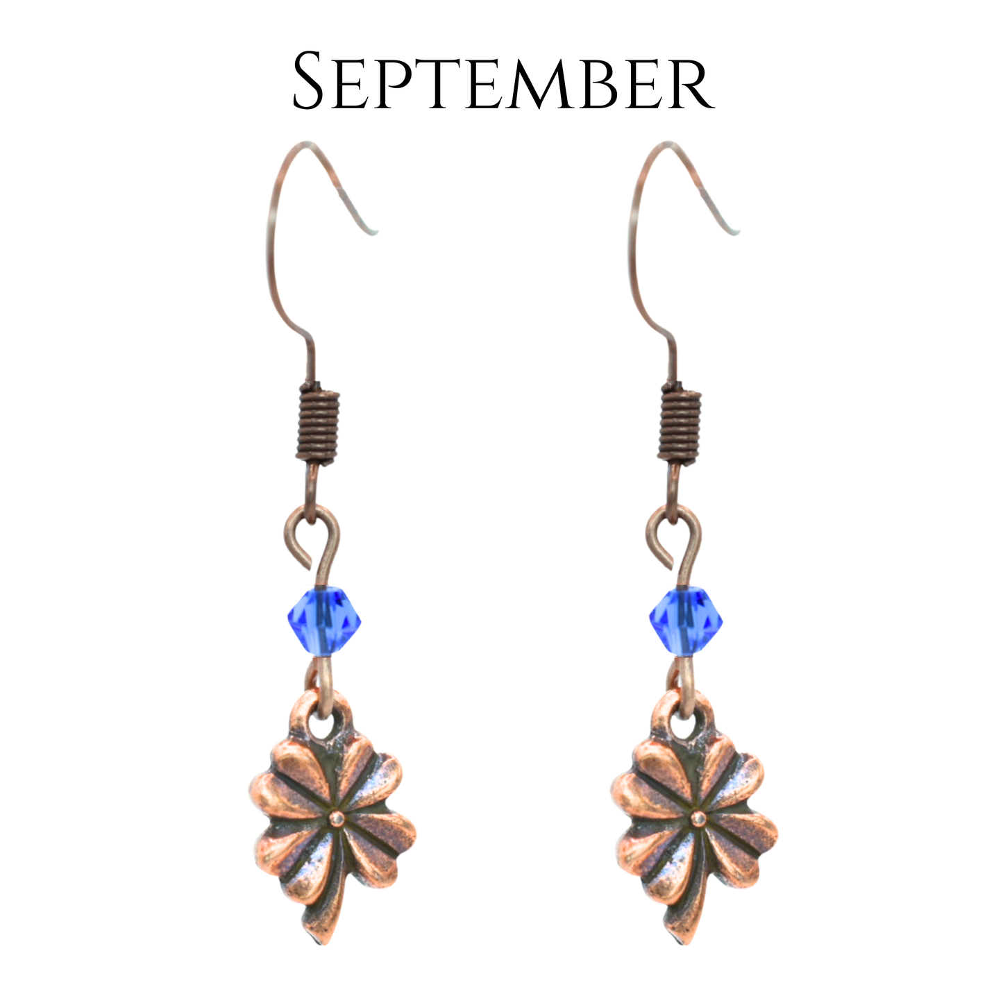 earrings featuring antique copper four leaf clover charms and Austrian crystal beads in September birthstone colors