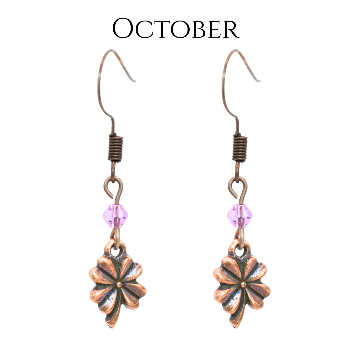 earrings featuring antique copper four leaf clover charms and Austrian crystal beads in October birthstone colors