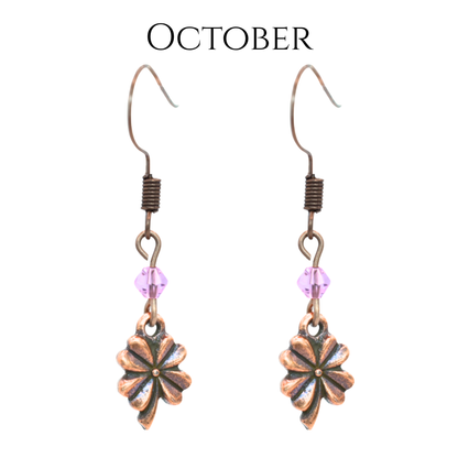 earrings featuring antique copper four leaf clover charms and Austrian crystal beads in October birthstone colors