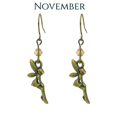 Bronze fairy earrings with tan topaz beads on a white background, labeled 'November'.