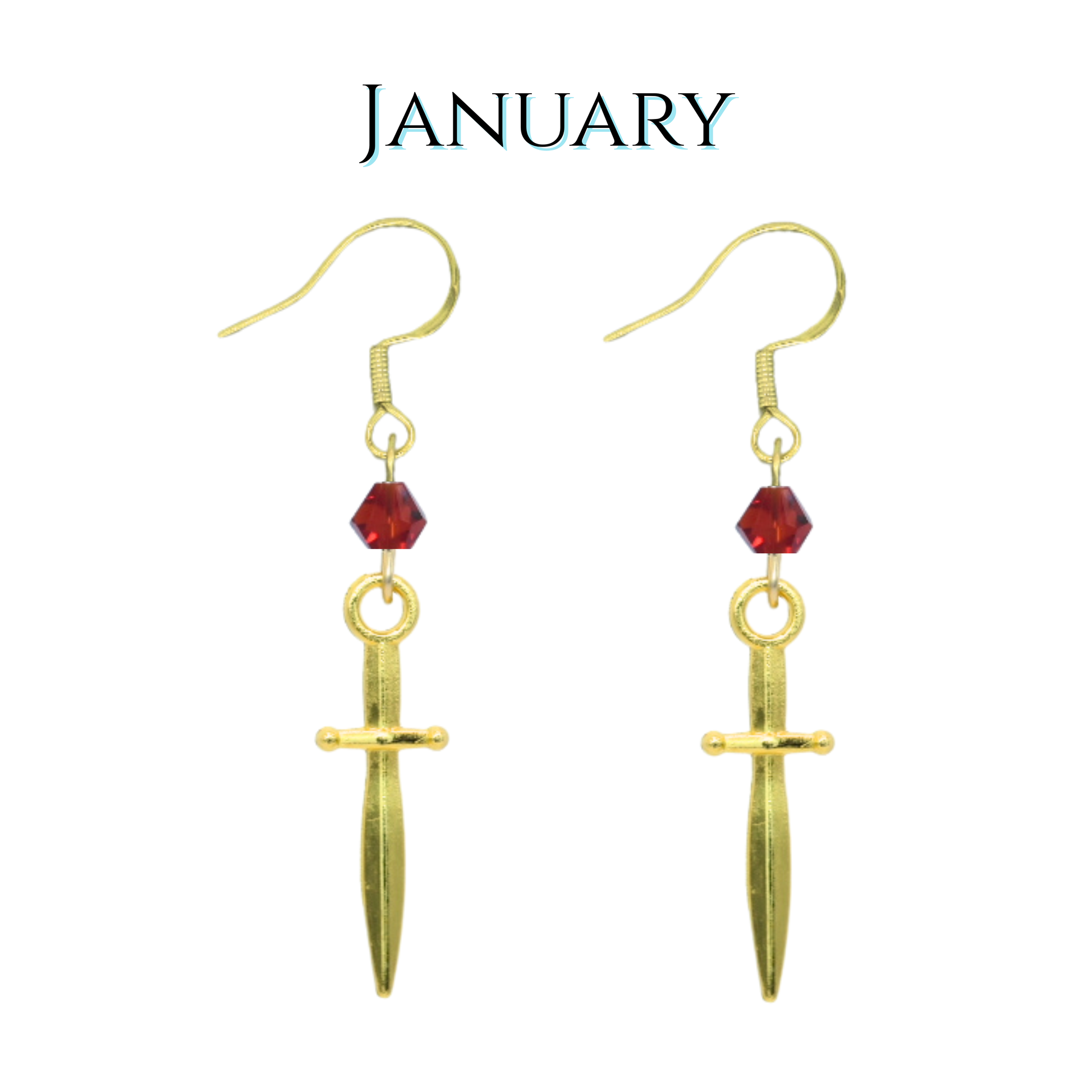 Gold dagger-shaped earrings with red crystal beads on a white background, labeled 'January'.