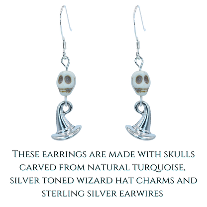 Pair of skull-themed earrings with turquoise stones on a white background