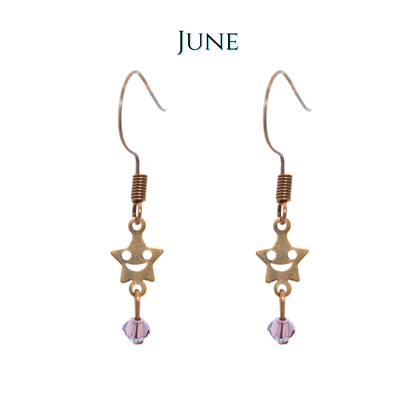 Star-shaped earrings with a purple bead on a white background, labeled 'JUNE'.