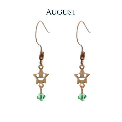 Star-shaped earrings with green beads on a white background, labeled 'August'.