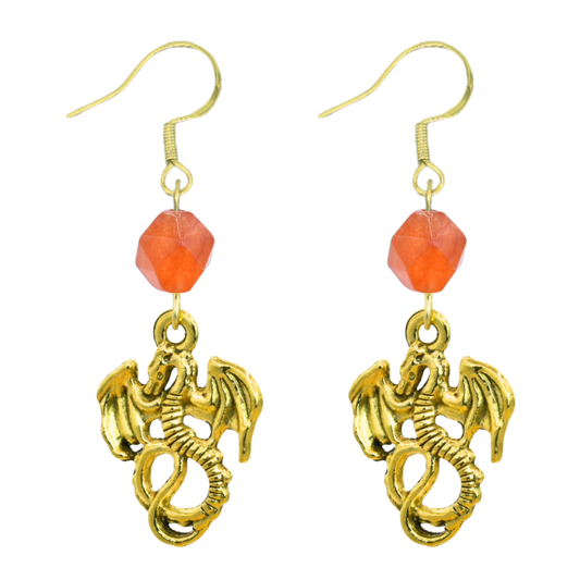 Gold dragon earrings with orange beads on a white background