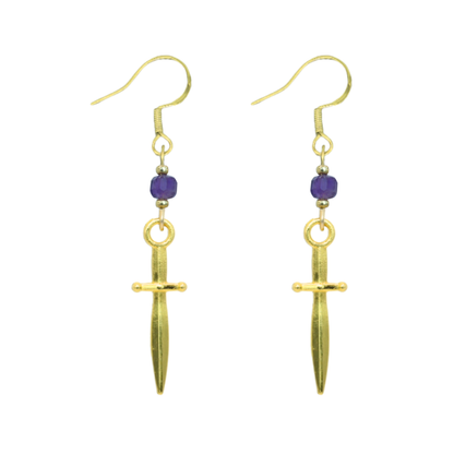Gold dagger-shaped earrings with purple beads on a white background