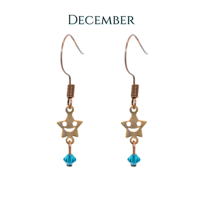 Star-shaped earrings with blue beads on a white background, labeled 'December'.