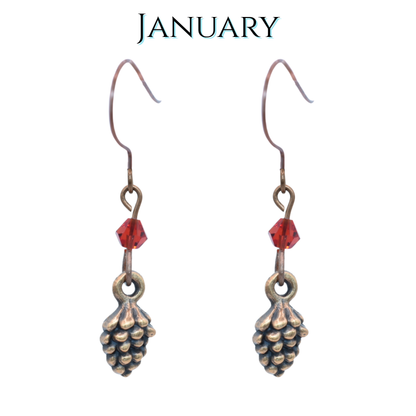 Pinecone-shaped earrings with red crystal beads on a white background, labeled 'January'.