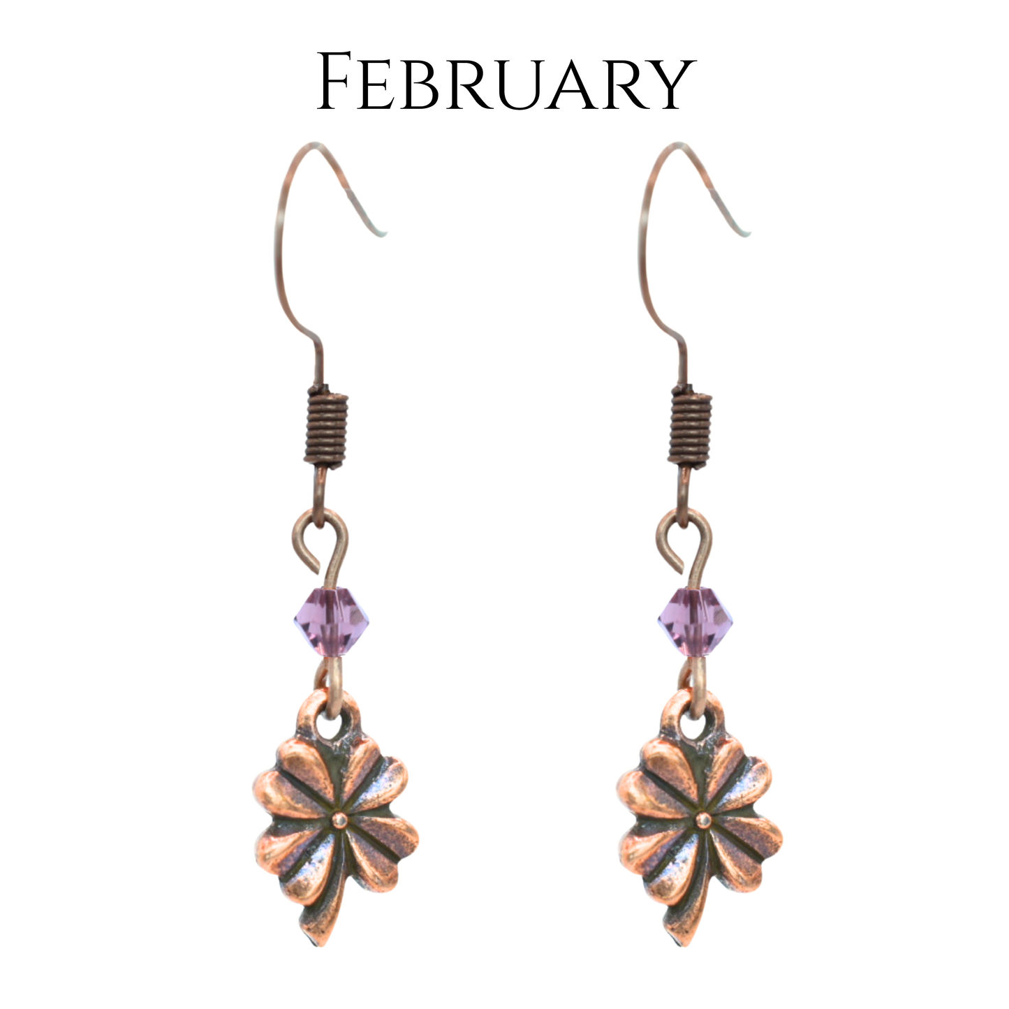 earrings featuring antique copper four leaf clover charms and Austrian crystal beads in February  birthstone colors