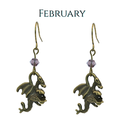 earrings featuring antique bronze dragon charms and purple crystal beads, image has text "February"