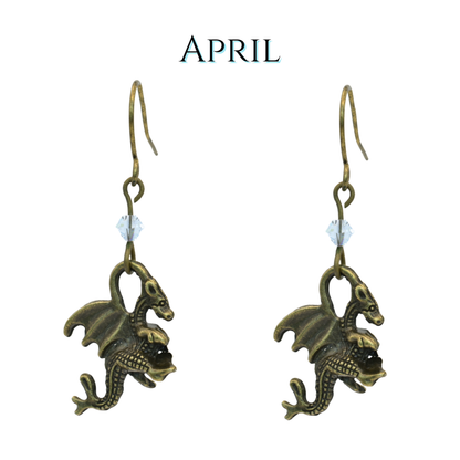 earrings featuring antique bronze dragon charms and clear crystal beads, image has text "April"