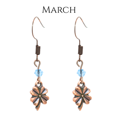earrings featuring antique copper four leaf clover charms and Austrian crystal beads in March birthstone colors
