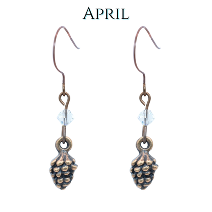 Antique copper pinecone-shaped earrings with clear crystals on a white background, featuring the word 'APRIL'.