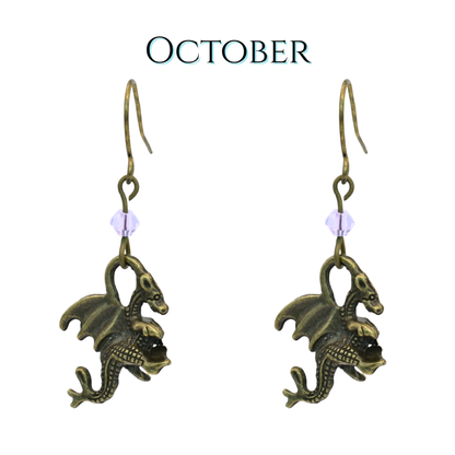 earrings featuring antique bronze dragon charms and light pink crystal beads, image has text "October"