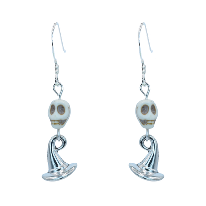 Pair of skull-shaped earrings on a white background