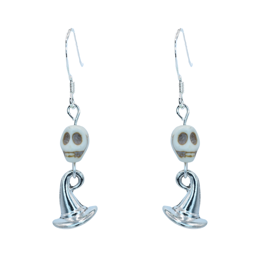 Pair of skull-shaped earrings on a white background