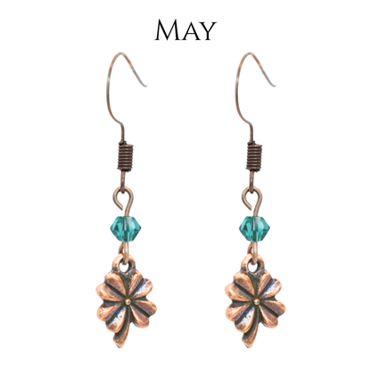 earrings featuring antique copper four leaf clover charms and Austrian crystal beads in May birthstone colors
