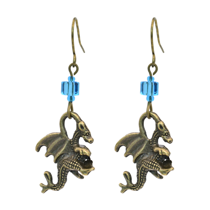 Dragon-shaped earrings with blue cube crystal beads on a white background