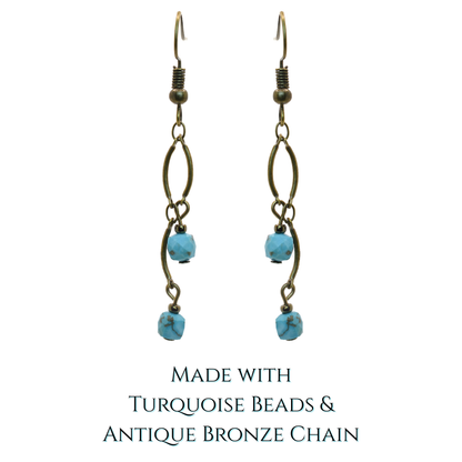 Pair of earrings with turquoise beads and antique bronze chain on a white background