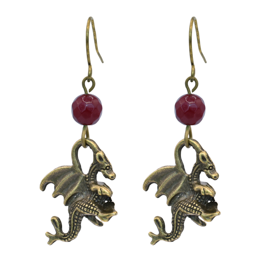 Dragon-shaped earrings with red jade beads on a white background