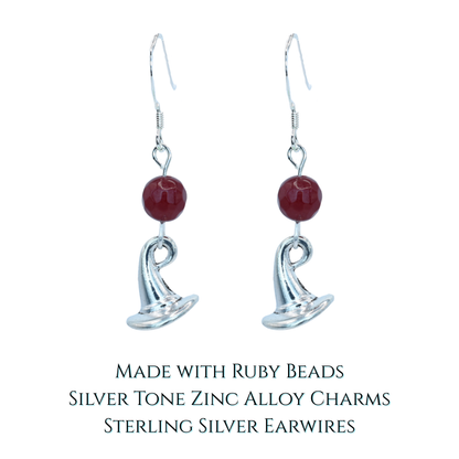 Silver earrings with ruby red jade beads and a wizard hat charm on a white background