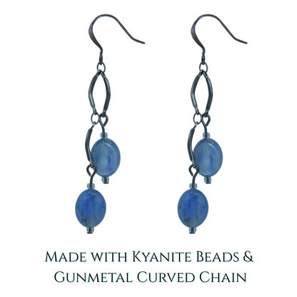 Pair of earrings with blue kyanite beads and gunmetal curved chain on a white background.