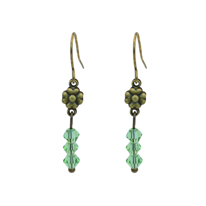 Pair of earrings with green Austrian crystal beads and antique bronze flowers on a white background